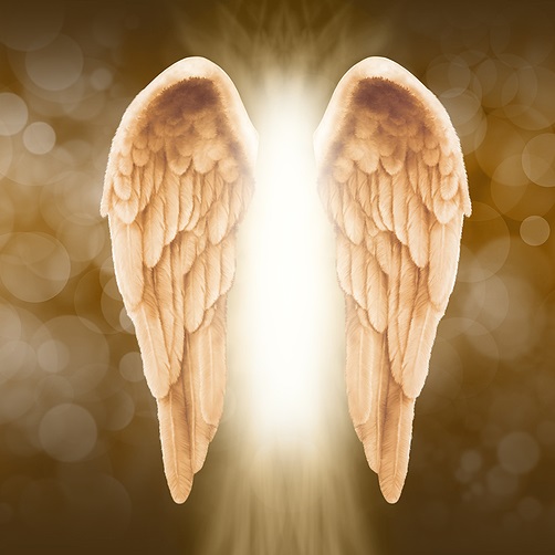 Angelic figure of white light with beautiful golden wings against background of golden lights or orbs